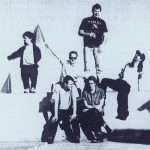This is Whizzy---a band from New York City, circa the mid to late '90s. Here we are, up on a rooftop. On the ledge (L to R), the risk takers---Peter Dinklage, Bowman Hastie, Jeff Nathenson and Josh Weisberg. Seated, away from the ledge, (L to R), David Sechy and Jimmy Angelina